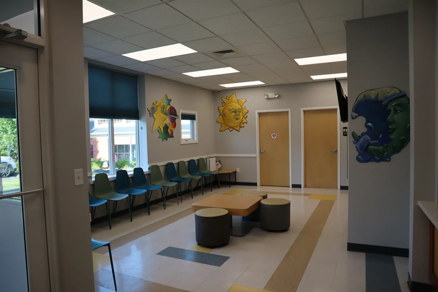 The bright waiting area at The Pediatric Care Center
